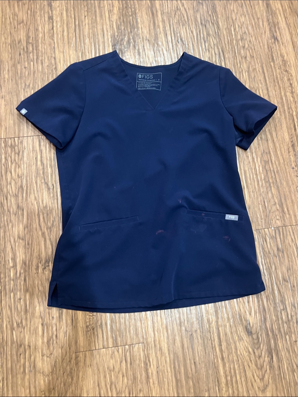 FIGS Navy Short-Sleeve V-Neck Scrub Top
Size: S
Has bleach stains